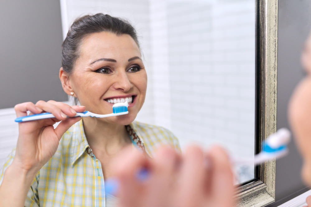 Caring for dental implants with proper brushing and oral hygiene - The Artistic Dentistry